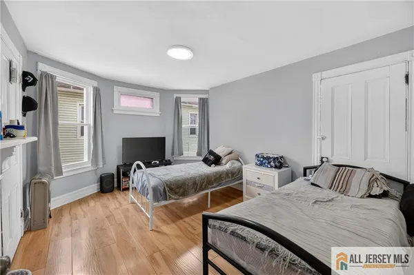 a view of a livingroom with workspace and a window