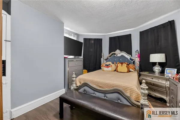 a bed room with a bed and a large mirror