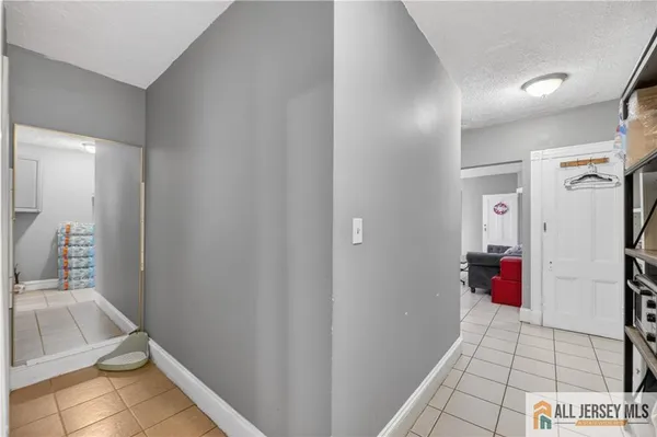 a bathroom with a sink vanity mirror and toilet