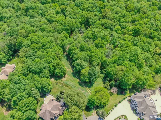 an aerial view of a house with yard