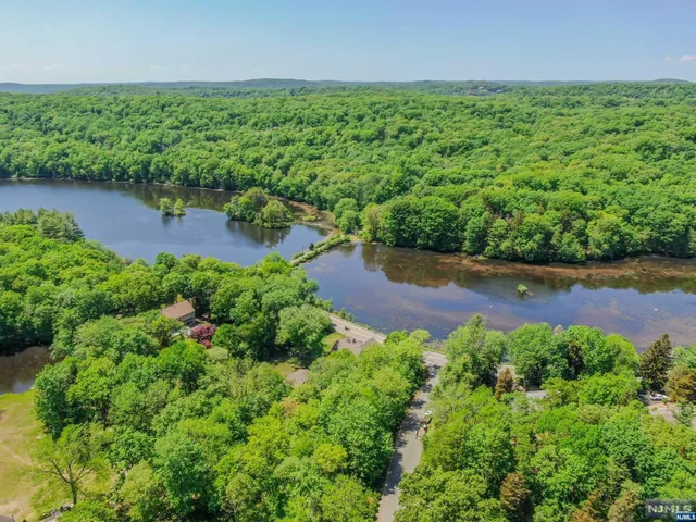 an aerial view of a houses with a yard