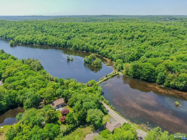 a view of a lake with a yard