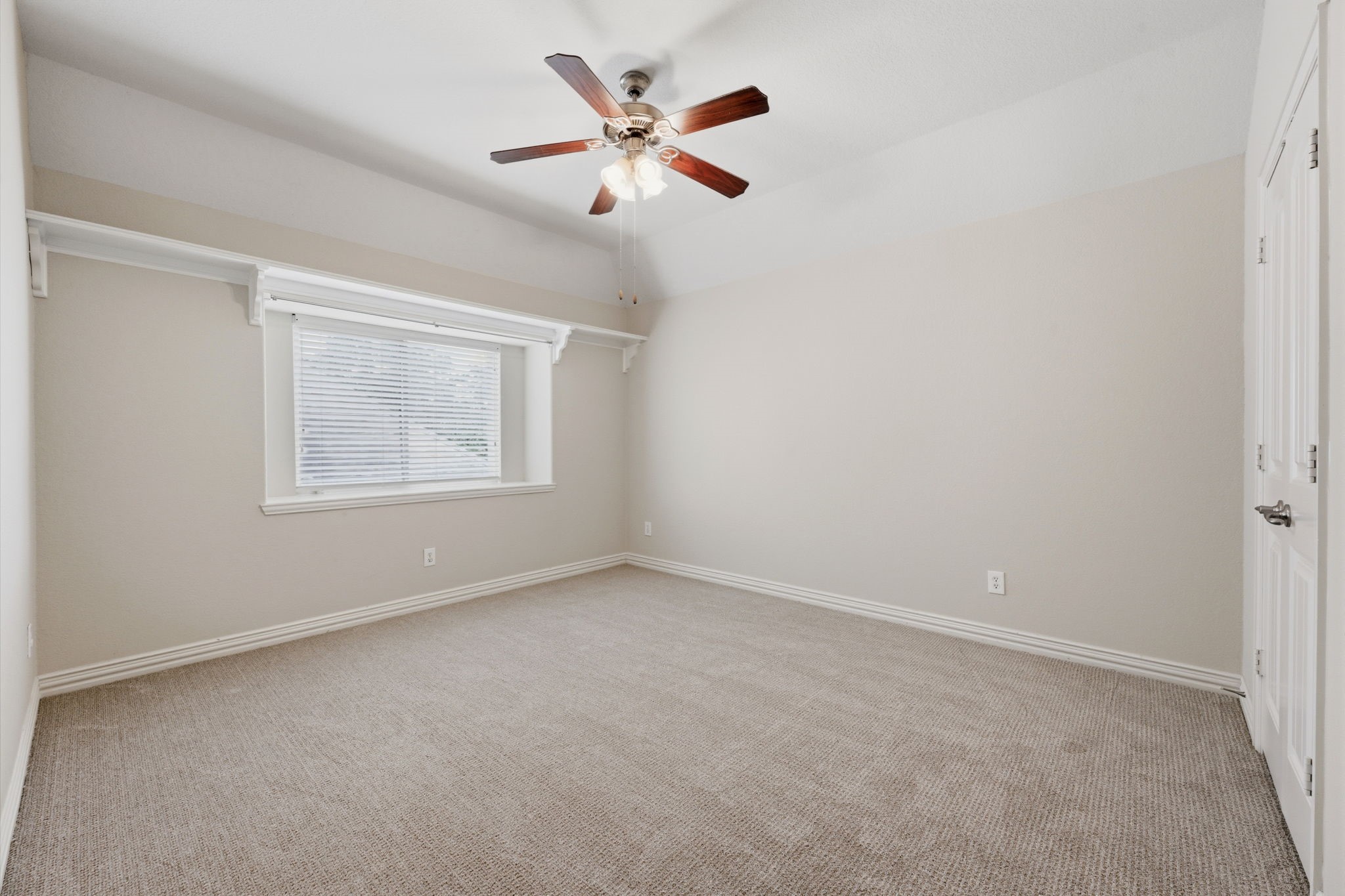 315 Arbor Ridge Lane Conroe, TX 77384 - Photo 28 of 48 an empty room with ceiling fan and windows