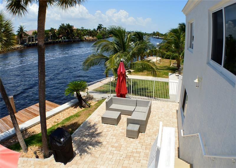 1705 North Riverside Drive, Unit 5 Pompano Beach, FL 33062 - Photo 21 of 24 a view of swimming pool with a patio and garden