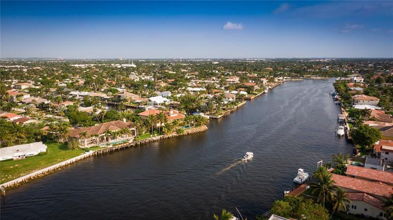 1705 North Riverside Drive, Unit 5 Pompano Beach, FL 33062 - Photo 23 of 24 an aerial view of residential houses with outdoor space