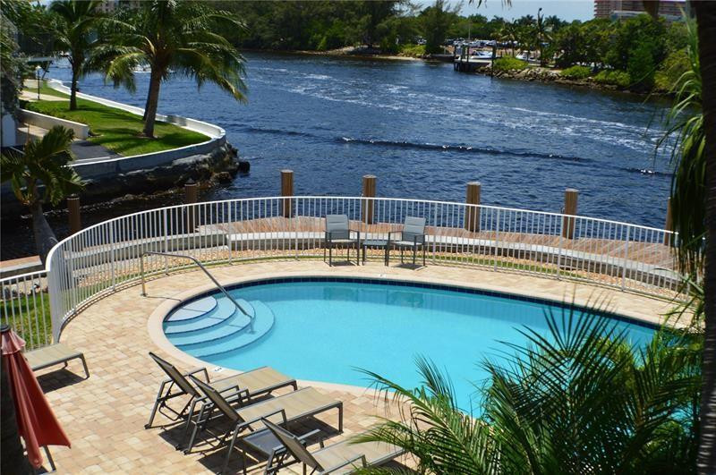 1705 North Riverside Drive, Unit 5 Pompano Beach, FL 33062 - Photo 5 of 24 a view of a swimming pool with a patio