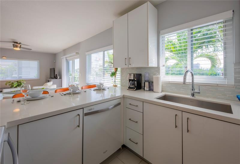1705 North Riverside Drive, Unit 5 Pompano Beach, FL 33062 - Photo 7 of 24 a kitchen with sink and window