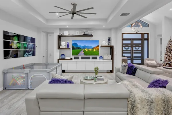 a living room with furniture and a flat screen tv