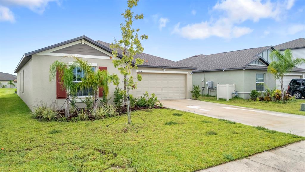 13124 Merlot Sunstone Cove Parrish, FL 34219 - Photo 3 of 45 a view of a house with backyard and garden
