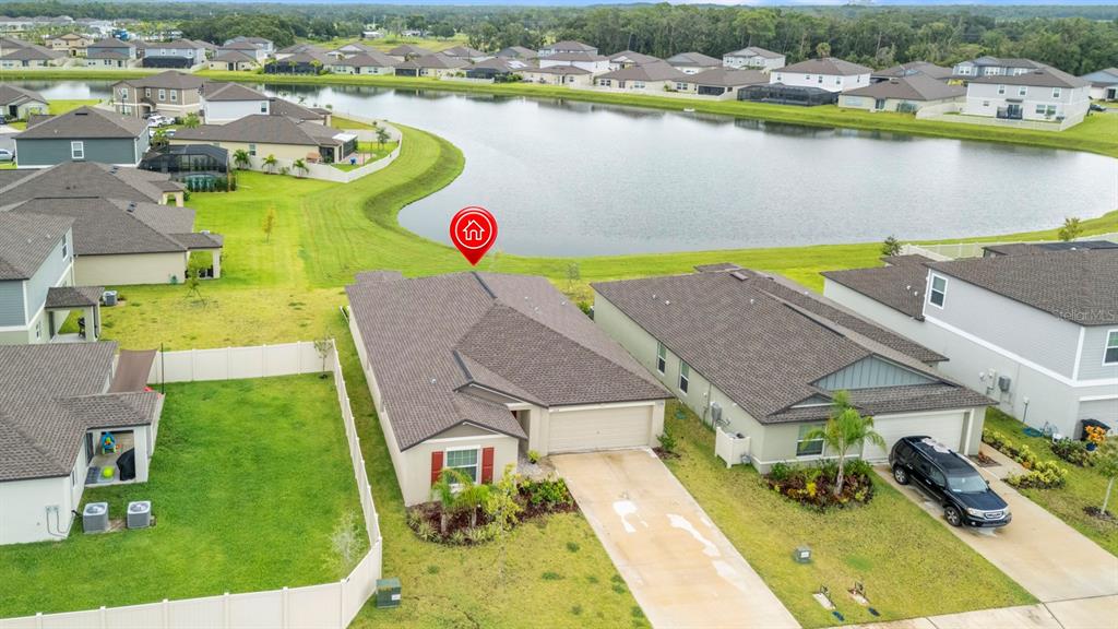 13124 Merlot Sunstone Cove Parrish, FL 34219 - Photo 7 of 45 an aerial view of a house with outdoor space and lake view