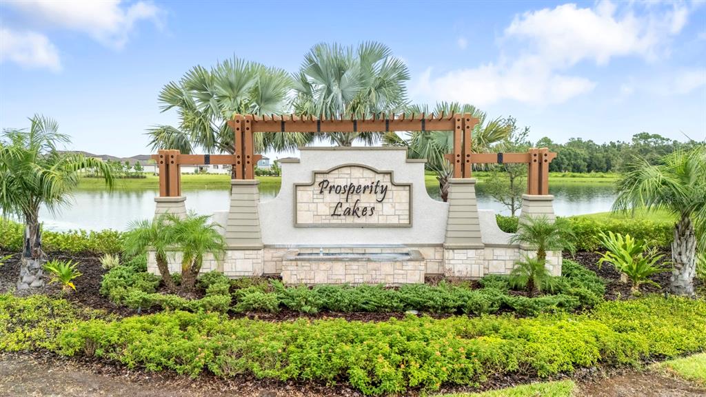 13124 Merlot Sunstone Cove Parrish, FL 34219 - Photo 9 of 45 a sign that is sitting on a brick wall