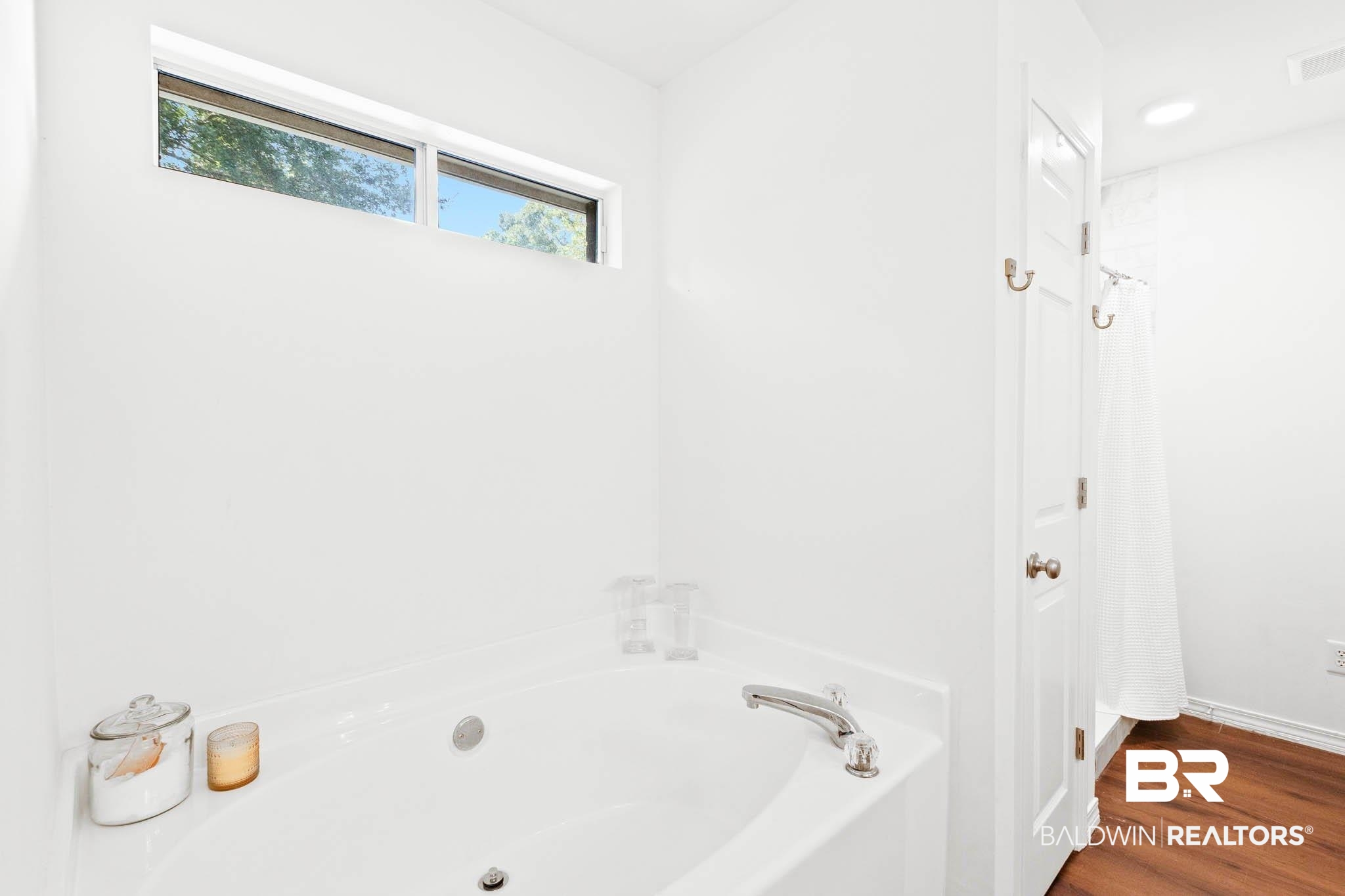 20685 Lowry Drive Fairhope, AL 36532 - Photo 30 of 48 Bathroom featuring a garden tub and dark wood-style floors