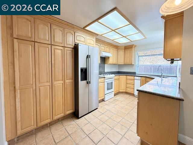 2321 Talavera Drive San Ramon, CA 94583 - Photo 16 of 50 a kitchen with stainless steel appliances granite countertop a refrigerator and a sink