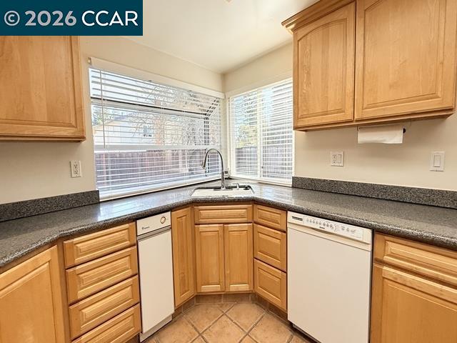 2321 Talavera Drive San Ramon, CA 94583 - Photo 18 of 50 a kitchen with granite countertop white cabinets and a sink