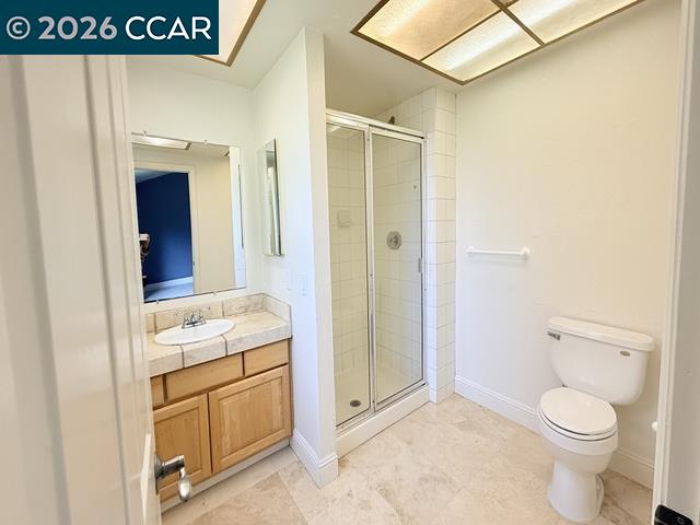 2321 Talavera Drive San Ramon, CA 94583 - Photo 29 of 50 a bathroom with a granite countertop sink a toilet and a shower