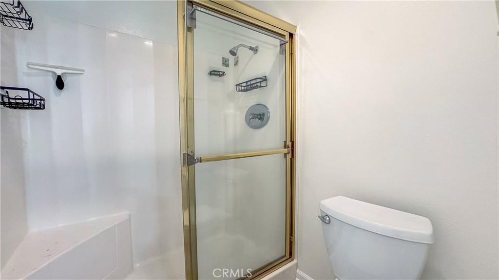 530 Spruce Way La Habra, CA 90631 - Photo 14 of 29 a bathroom with a shower a toilet and a mirror