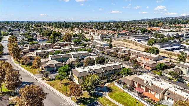 an aerial view of a residential houses with outdoor space