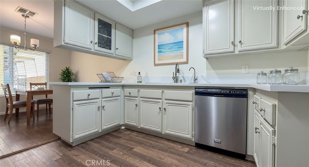 530 Spruce Way La Habra, CA 90631 - Photo 8 of 29 a kitchen with a sink cabinets and wooden floor