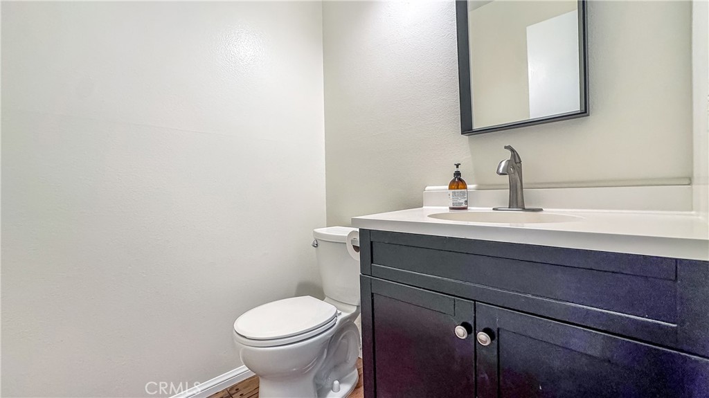 530 Spruce Way La Habra, CA 90631 - Photo 10 of 29 a bathroom with a toilet a sink and mirror