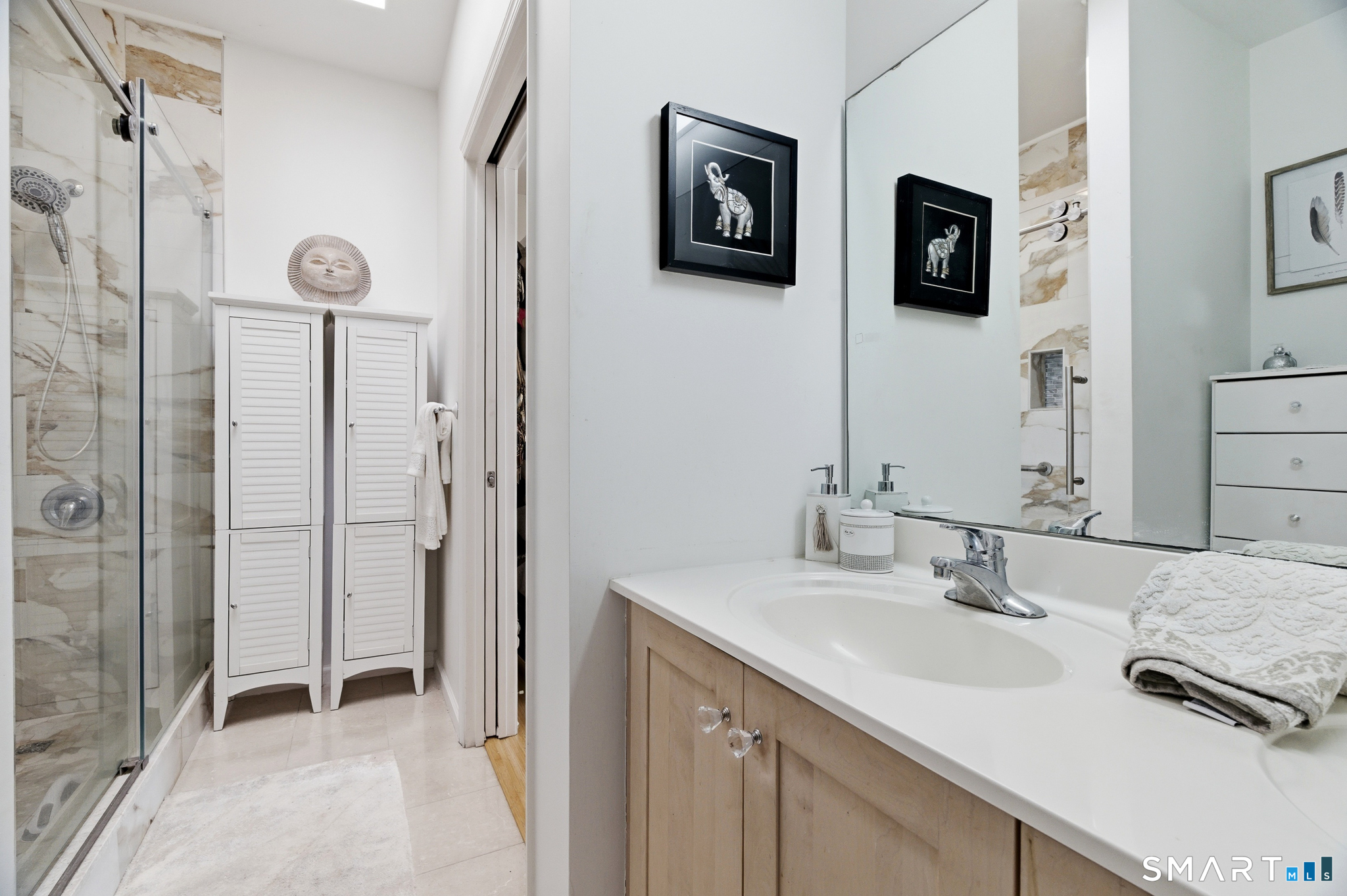 400 Bank Street, Unit 402 New London, CT 06320 - Photo 16 of 35 a bathroom with double sink and two mirror