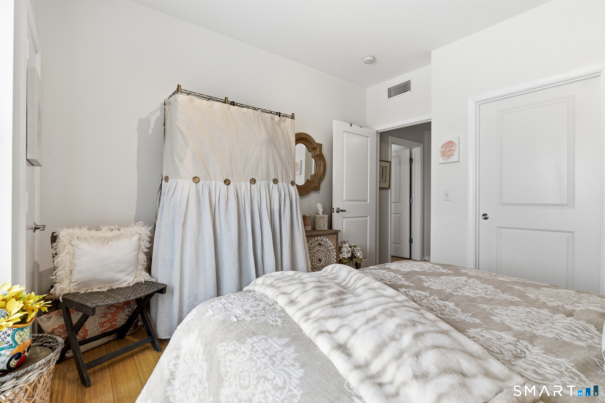 400 Bank Street, Unit 402 New London, CT 06320 - Photo 18 of 35 a bedroom with a bed and a table