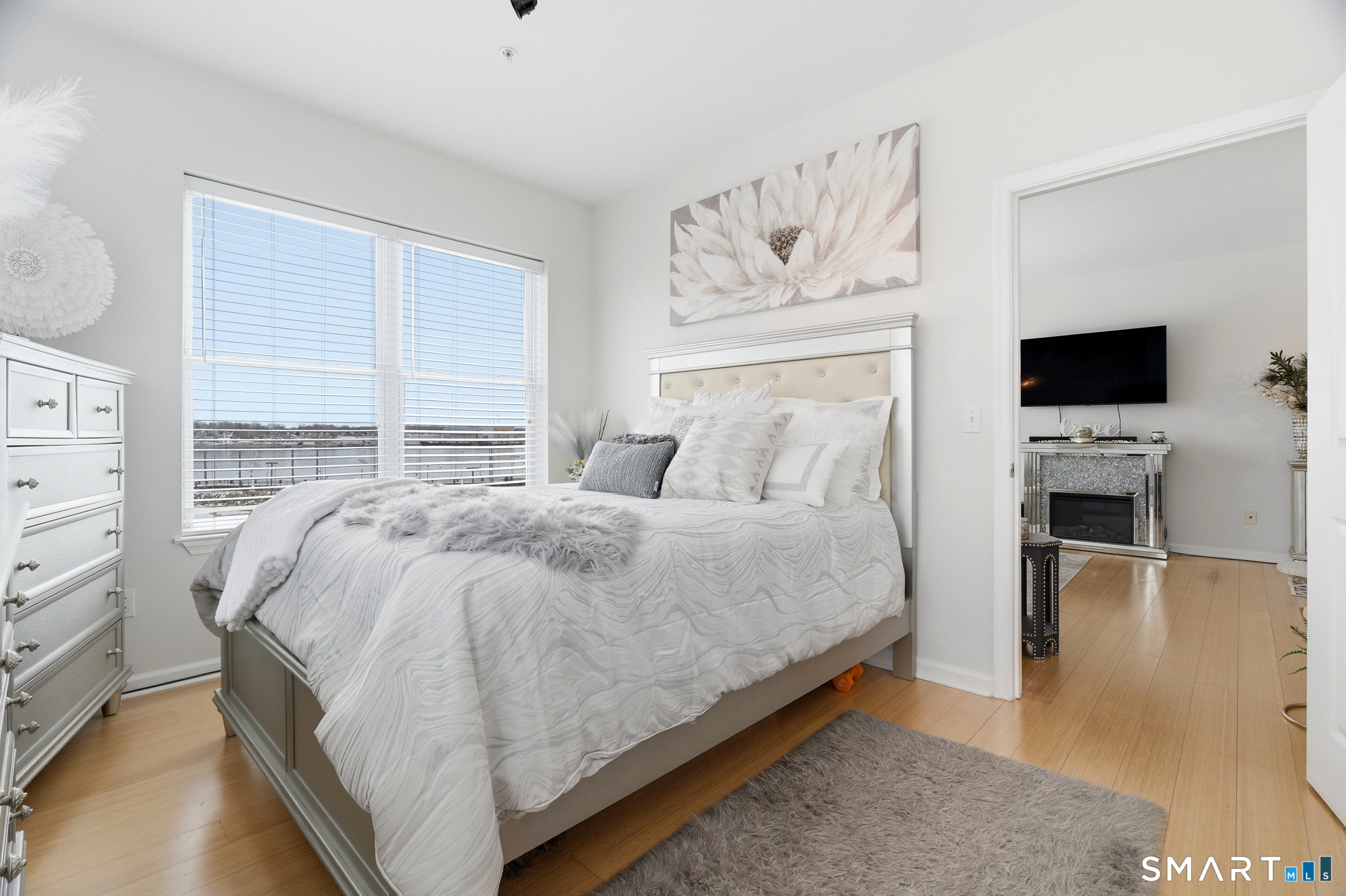 400 Bank Street, Unit 402 New London, CT 06320 - Photo 20 of 35 a bedroom with a bed and a flat screen tv