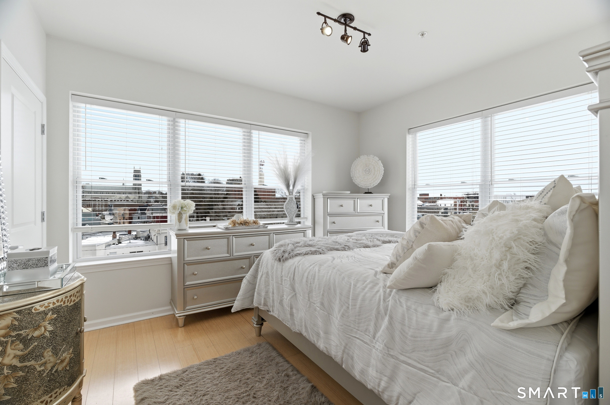 400 Bank Street, Unit 402 New London, CT 06320 - Photo 21 of 35 a bedroom with a large bed and a large window