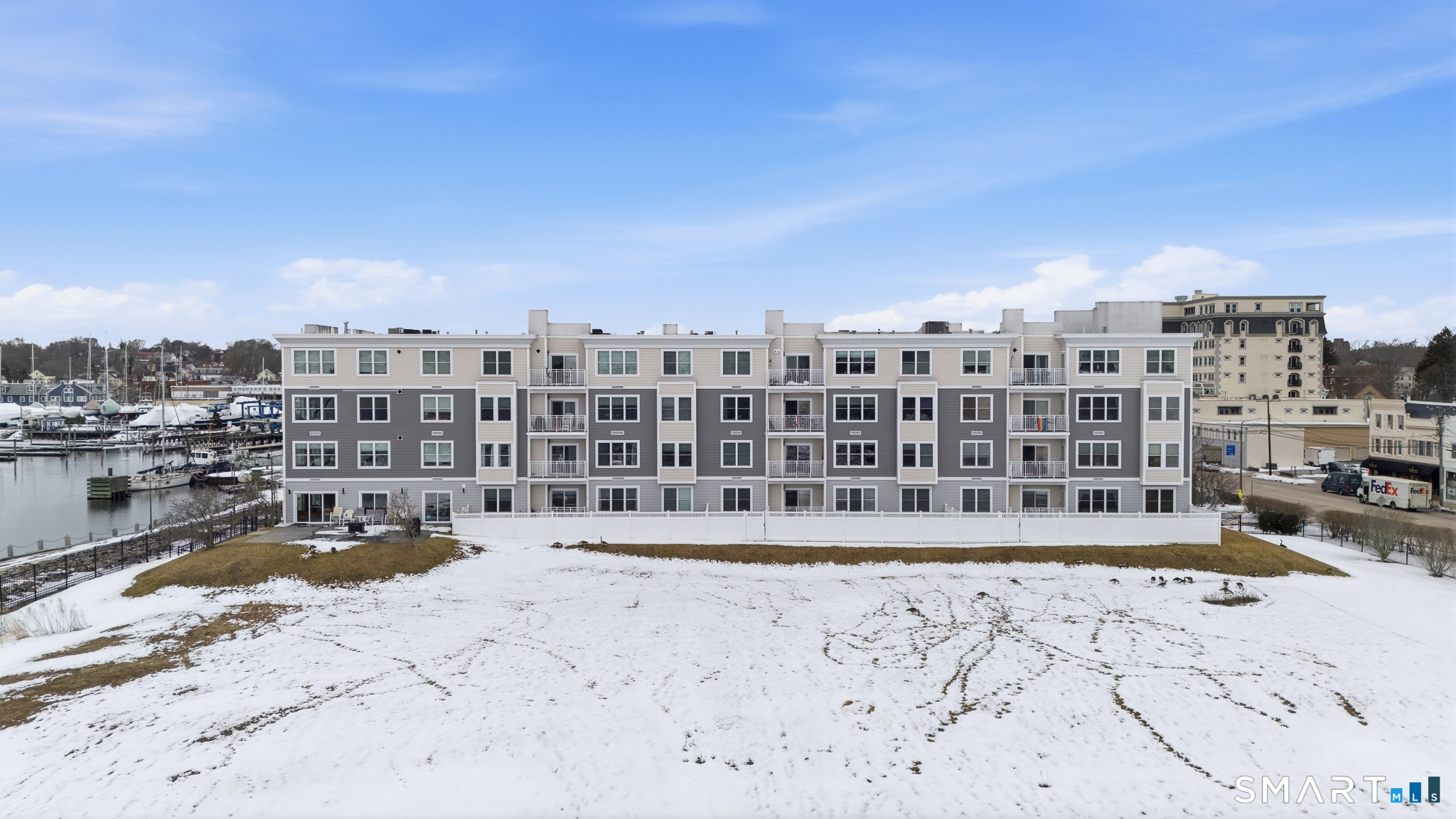 400 Bank Street, Unit 402 New London, CT 06320 - Photo 30 of 35 a view of swimming pool with outdoor seating and buildings in the background