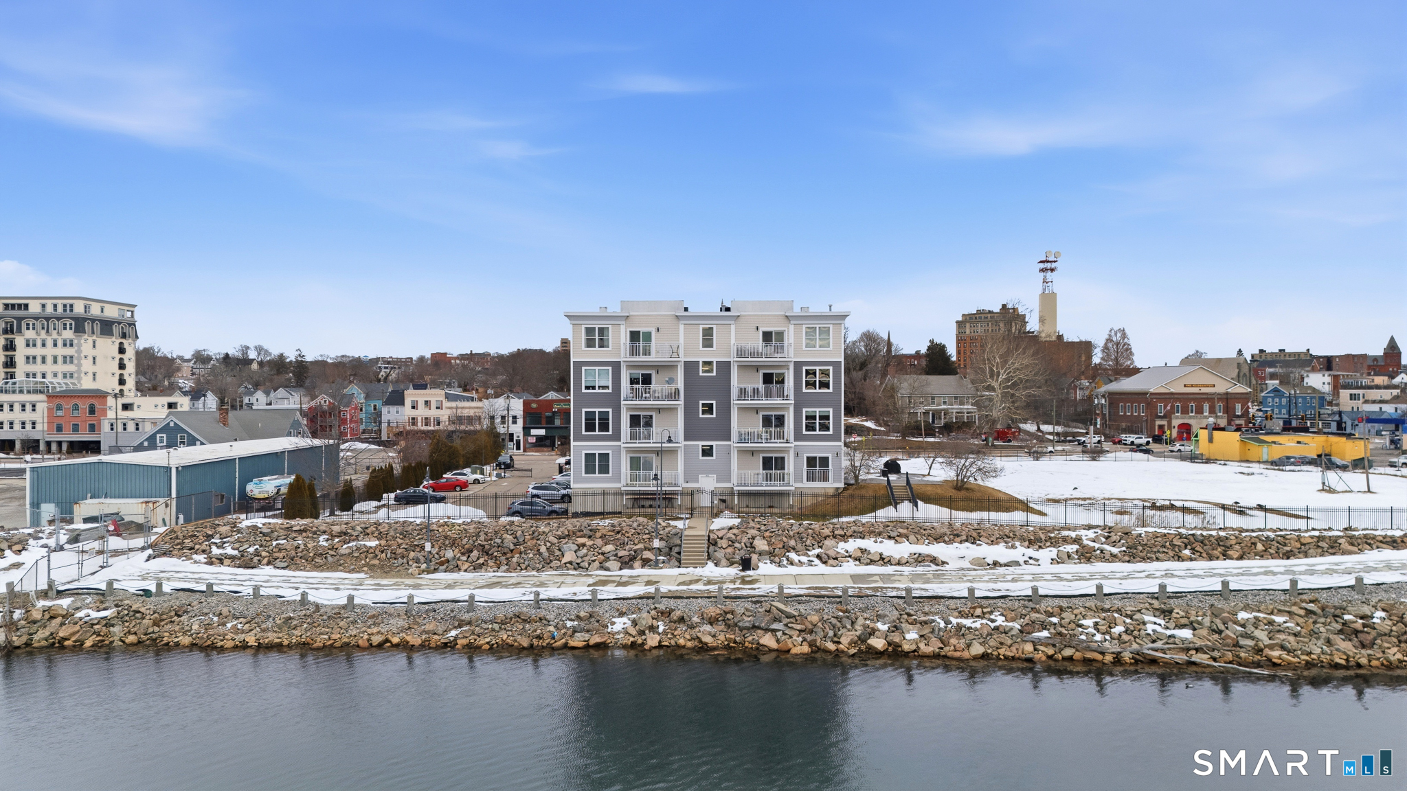 400 Bank Street, Unit 402 New London, CT 06320 - Photo 33 of 35 a view of a lake with a large building