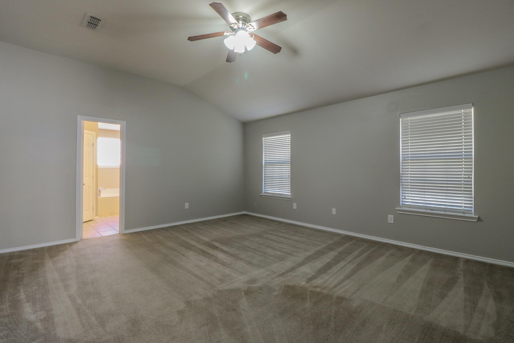 6808 88th Street Lubbock, TX 79424 - Photo 13 of 17 a view of an empty room with a window