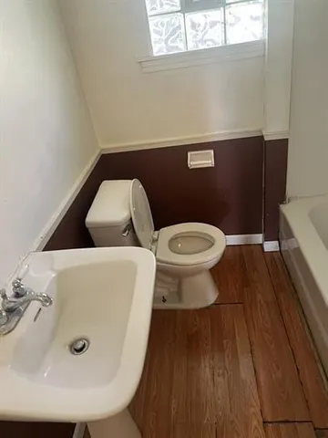 a bathroom with a toilet and a sink