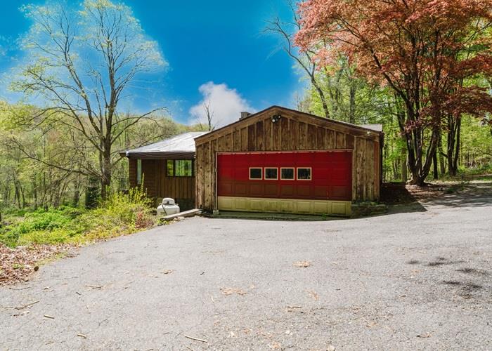309 Salem Road Pound Ridge, NY 10576 - Photo 1 of 1 a building with a sign board