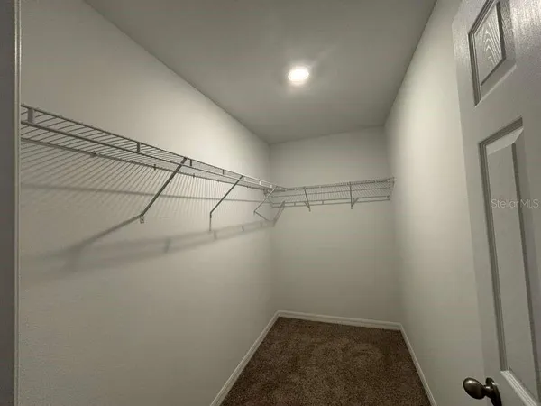 a view of a room with racks on the wall