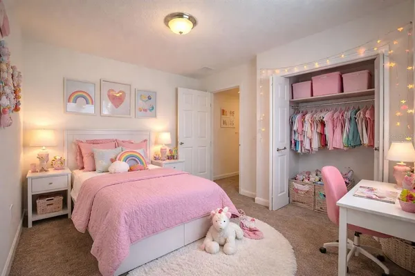 a bedroom with a bed and furniture