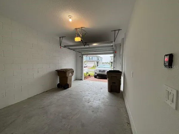 a view of a storage room with furniture and a window