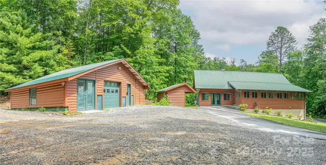 a wooden house with trees in front of it