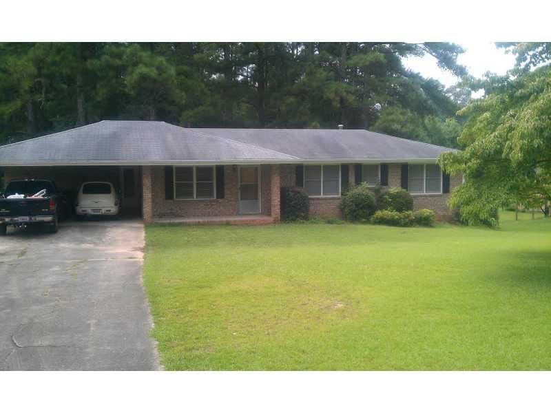 6270 Britt Road Mableton, GA 30126 - Photo 1 of 1 a view of a house with a backyard