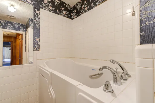 a view of a porch with wooden floor and stairs