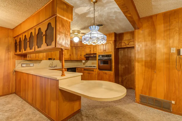 a kitchen with a stove and a sink