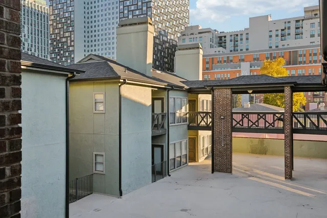 a view of a street with an outdoor seating