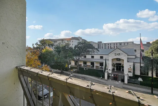 a view of a house with a swimming pool and a chairs