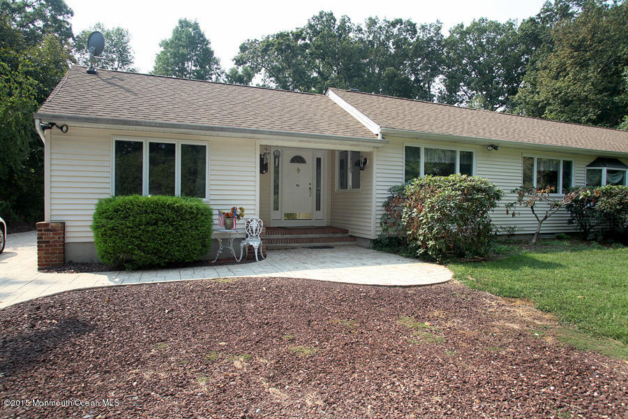 300 Merrick Road Farmingdale, NJ 07727 - Photo 1 of 27 a front view of a house with garden