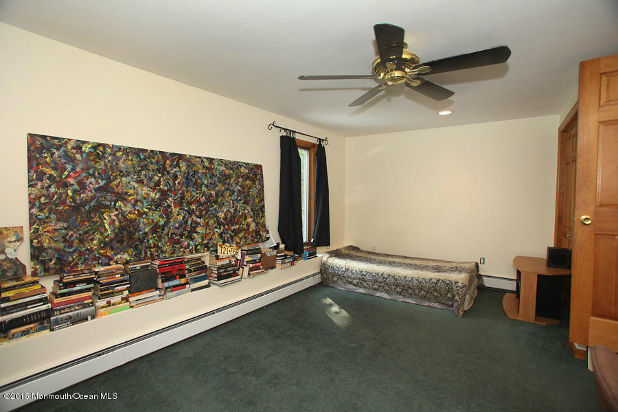 300 Merrick Road Farmingdale, NJ 07727 - Photo 16 of 27 a view of room with window and ceiling fan