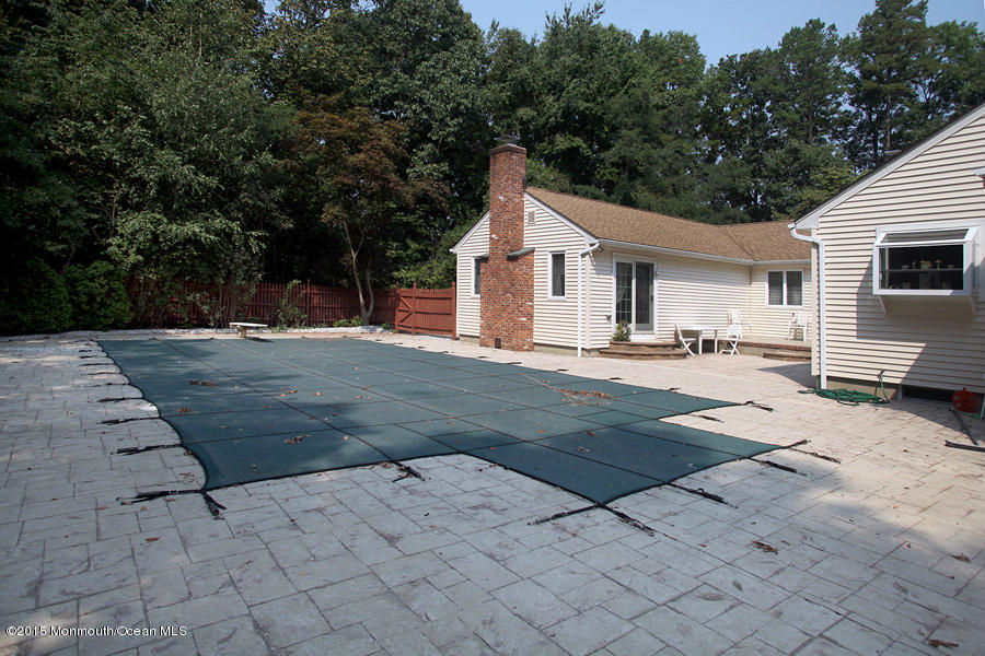 300 Merrick Road Farmingdale, NJ 07727 - Photo 19 of 27 a backyard of a house with yard and tree s