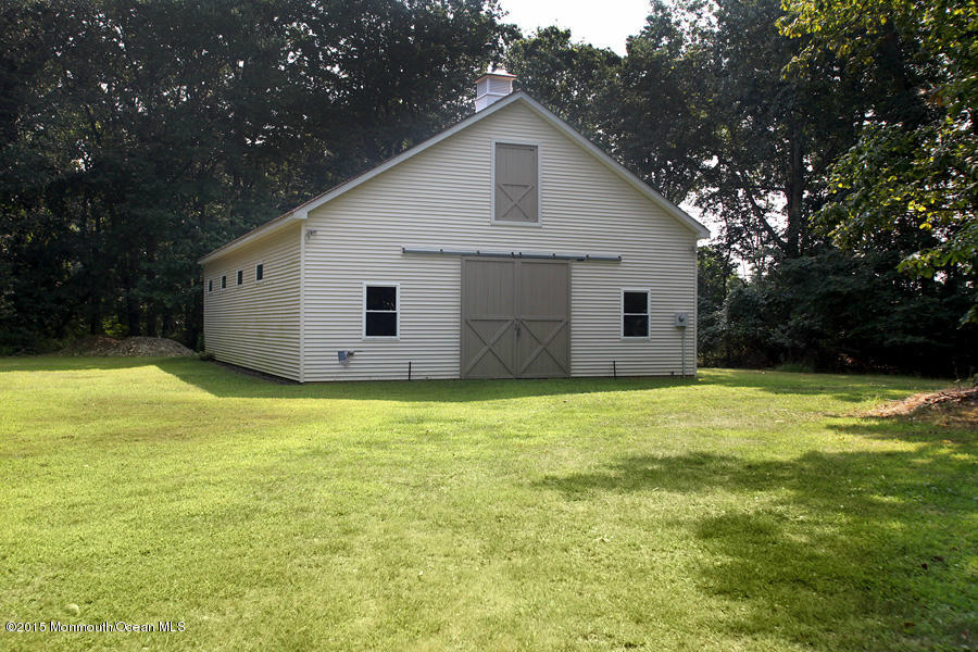 300 Merrick Road Farmingdale, NJ 07727 - Photo 23 of 27 a view of a backyard with a garden