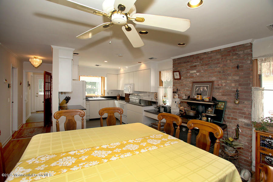 300 Merrick Road Farmingdale, NJ 07727 - Photo 7 of 27 a large bedroom with a bed and furniture