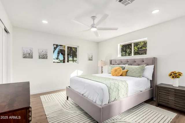 a bedroom with a bed and a couch