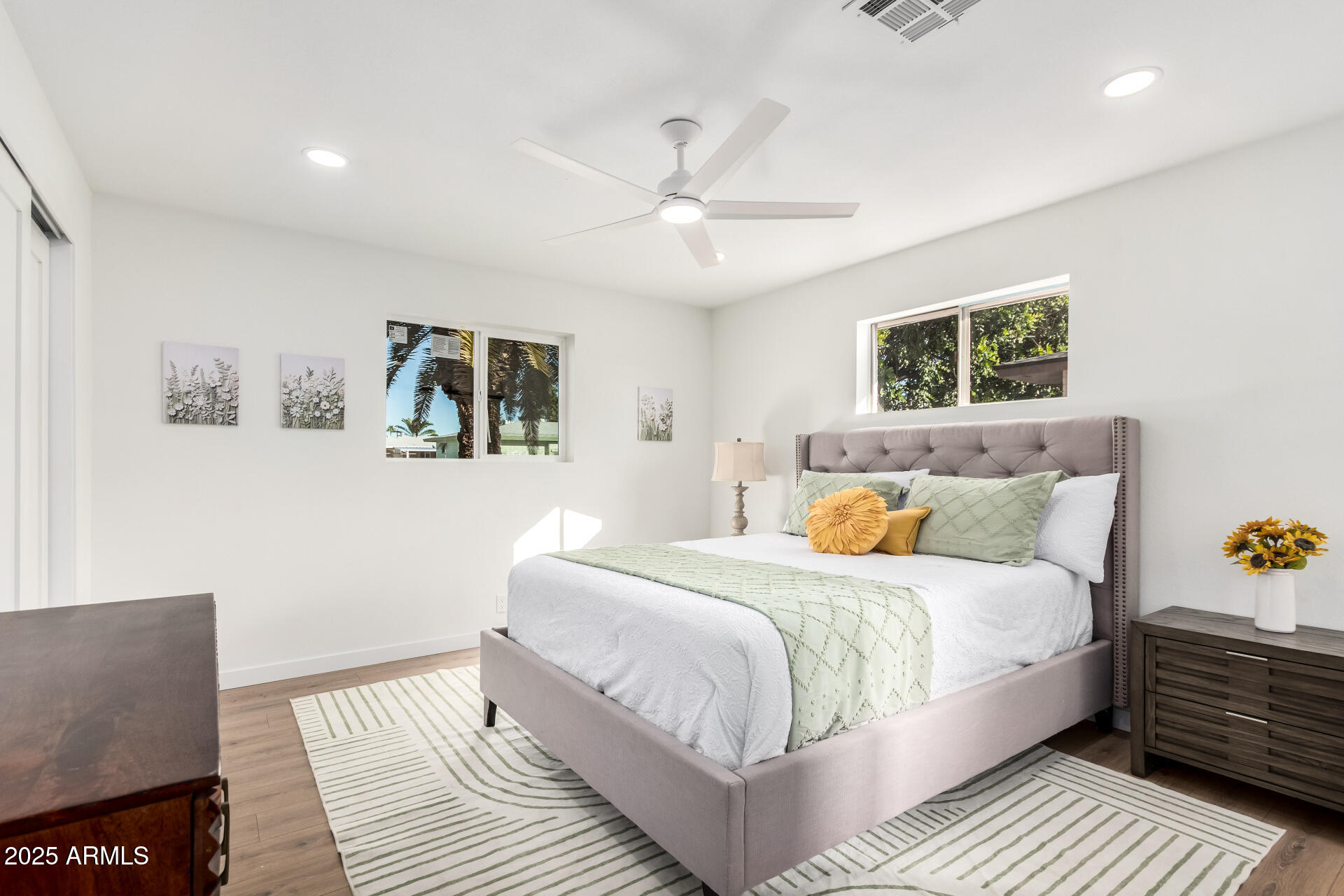 5237 East Dallas Street Mesa, AZ 85205 - Photo 11 of 30 a bedroom with a bed and a couch