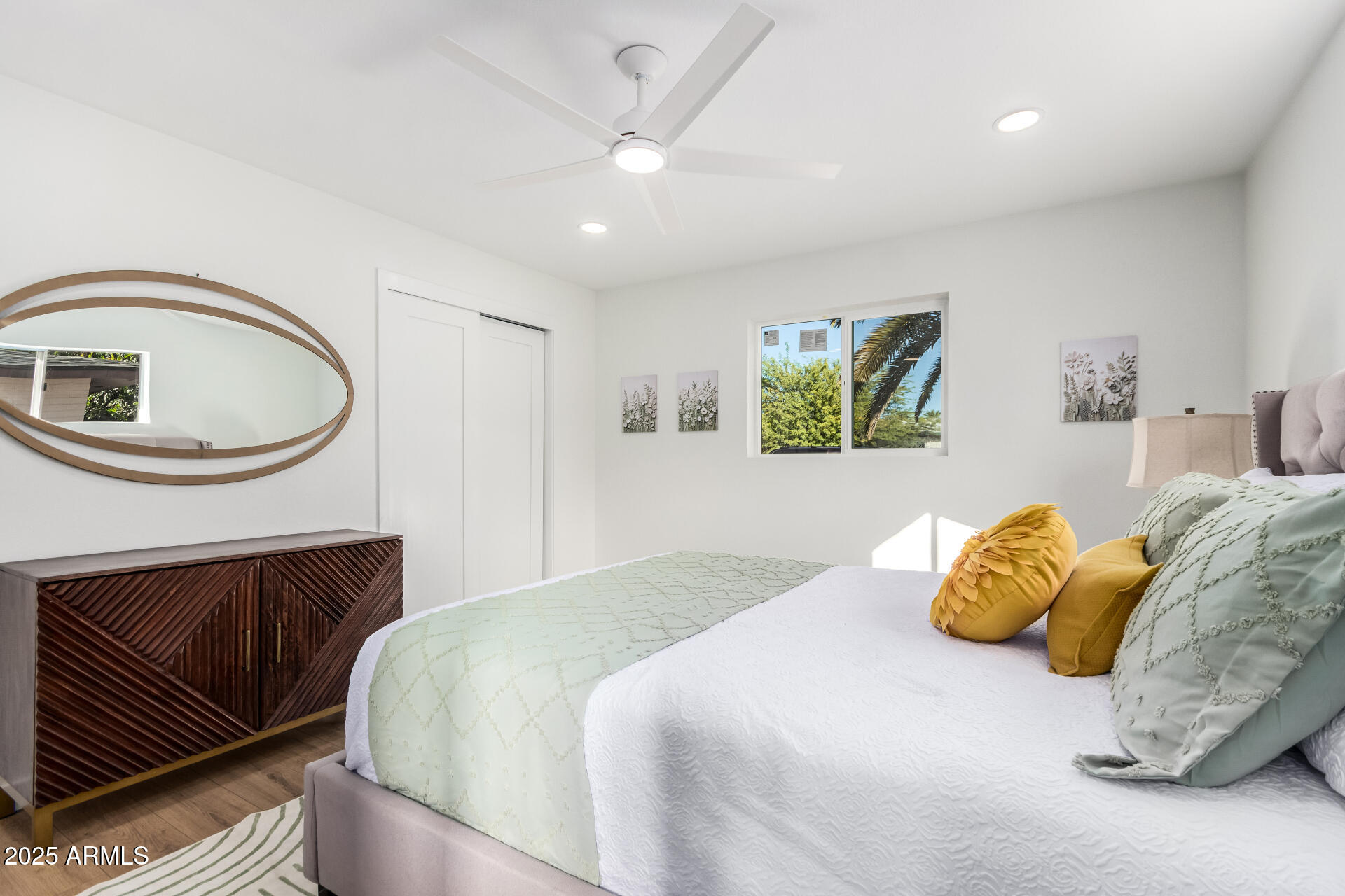 5237 East Dallas Street Mesa, AZ 85205 - Photo 12 of 30 a bedroom with a bed and a chandelier
