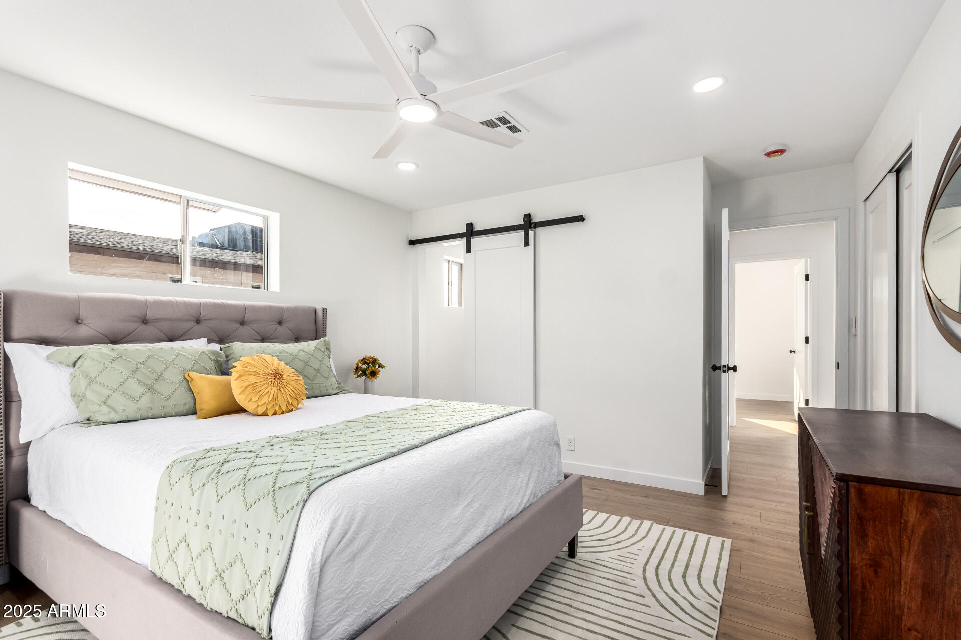 5237 East Dallas Street Mesa, AZ 85205 - Photo 13 of 30 a bedroom with a bed and wooden floor